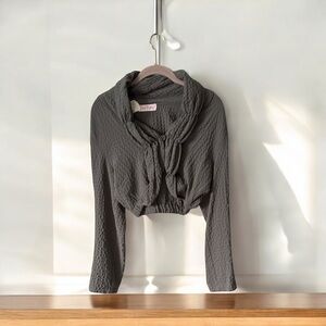 Eva Tratata’s grey shrug from Paris (see tags) one button style.